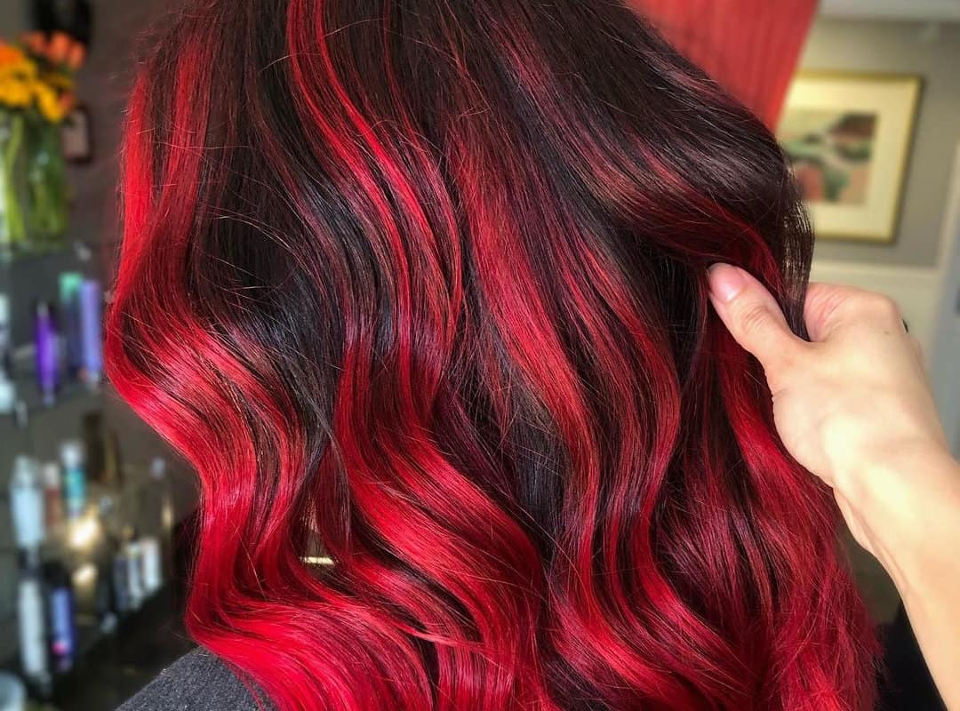 Black balayage with bright red highlights