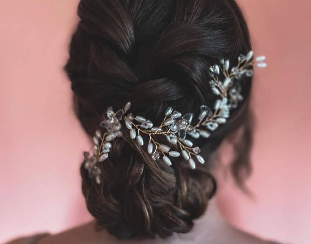 girl with dakr brown updo with a decoration