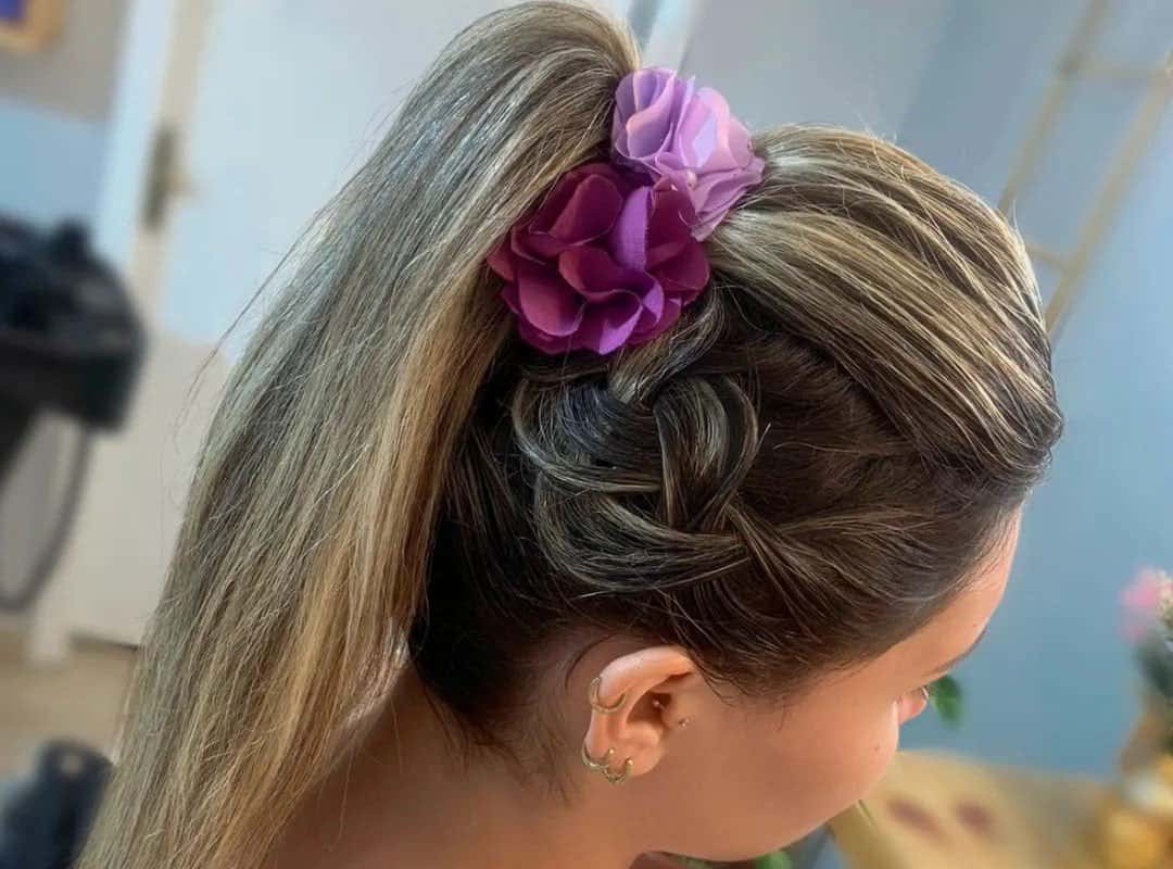 girl with blonde and brown ponytail with flowers 