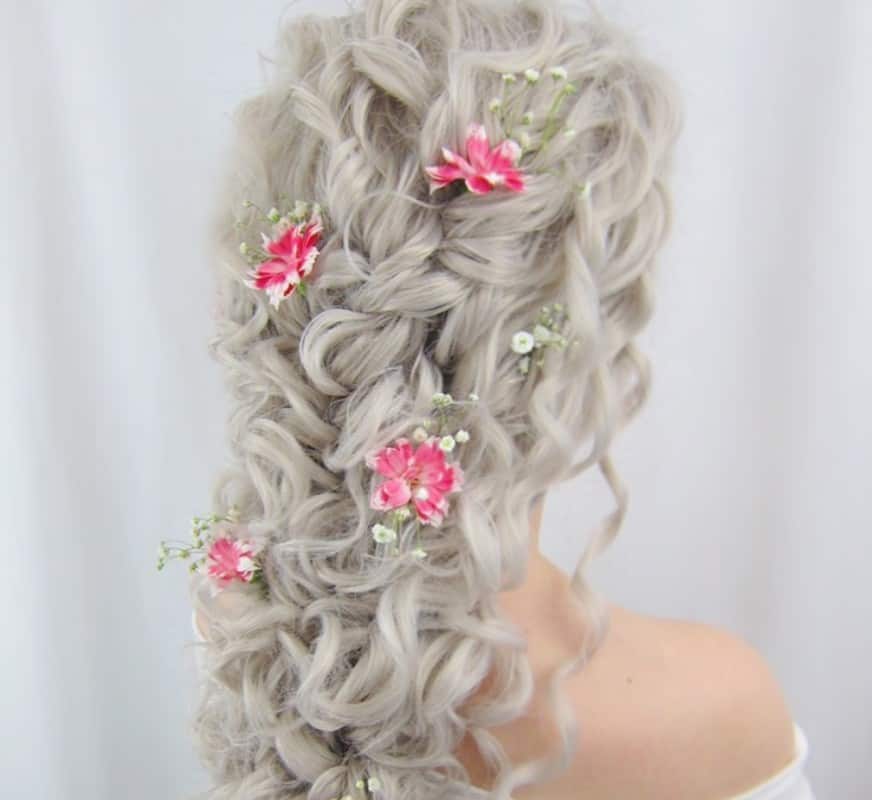 girl with white curly waterfall braid with decorations